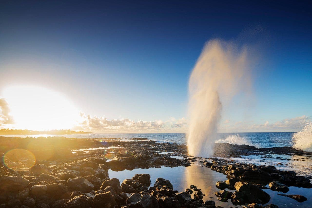 spouting horn blowhole in kauai at sunset