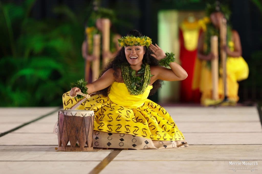 Hula dancer dressed all in yellow in Hawaii.