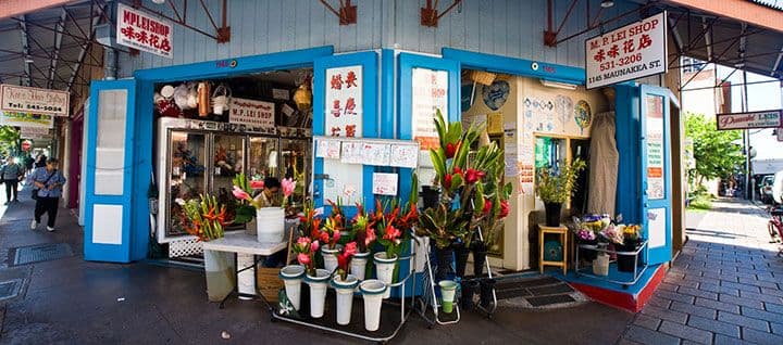 Lei stand on the corner in chinatown honolulu oahu hawaii.