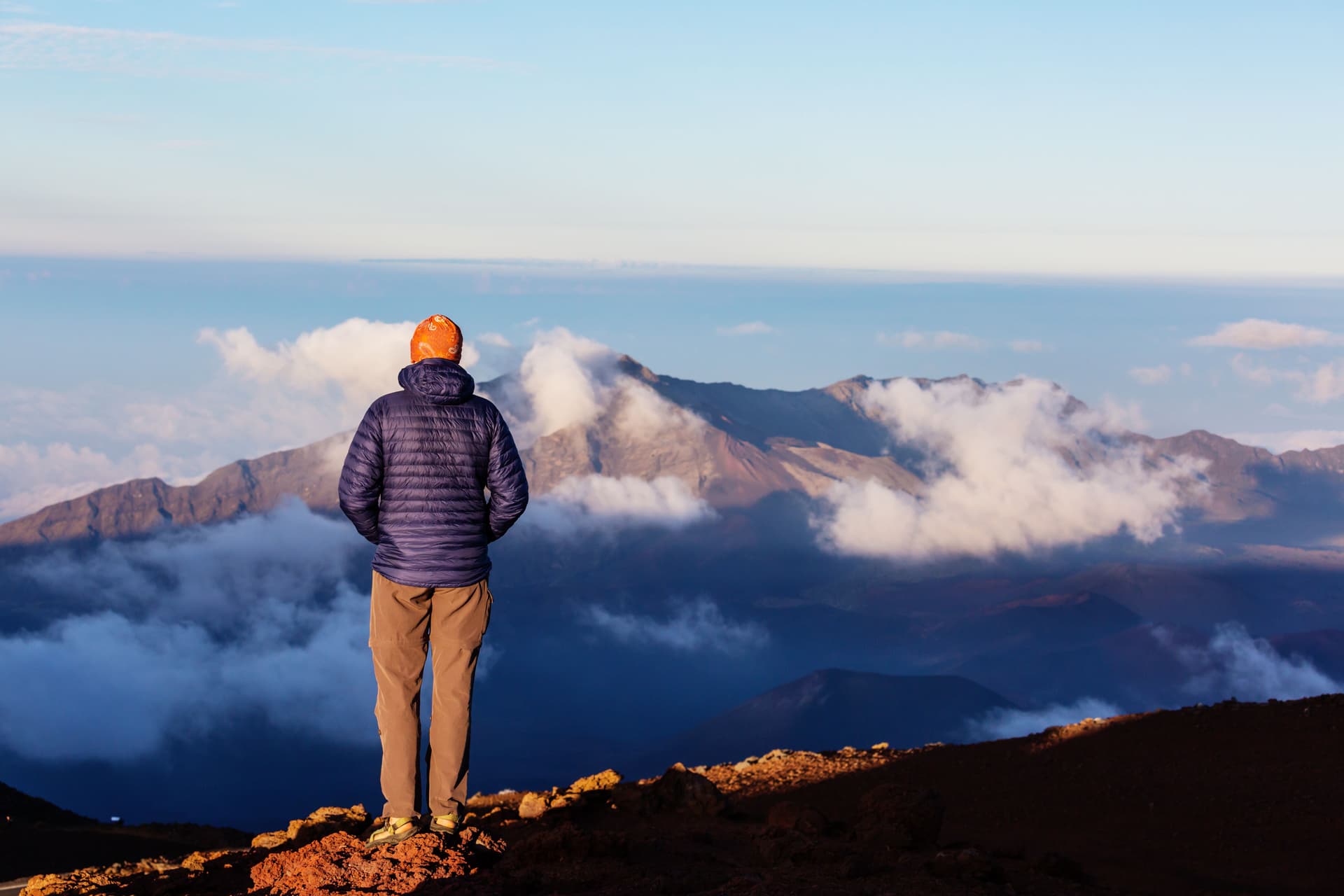 man watching sunrise at Haleakalā National Park