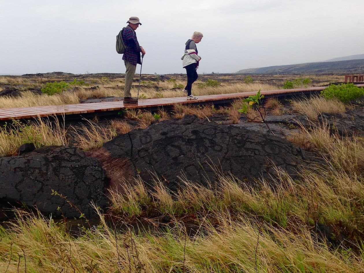 Walking the boardwalk with Pualoa Petroglyphs underfoot at hawaii volcano national park