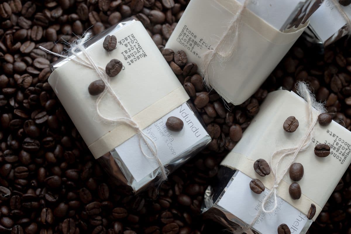 Packaged coffee in a pile of coffee beans.