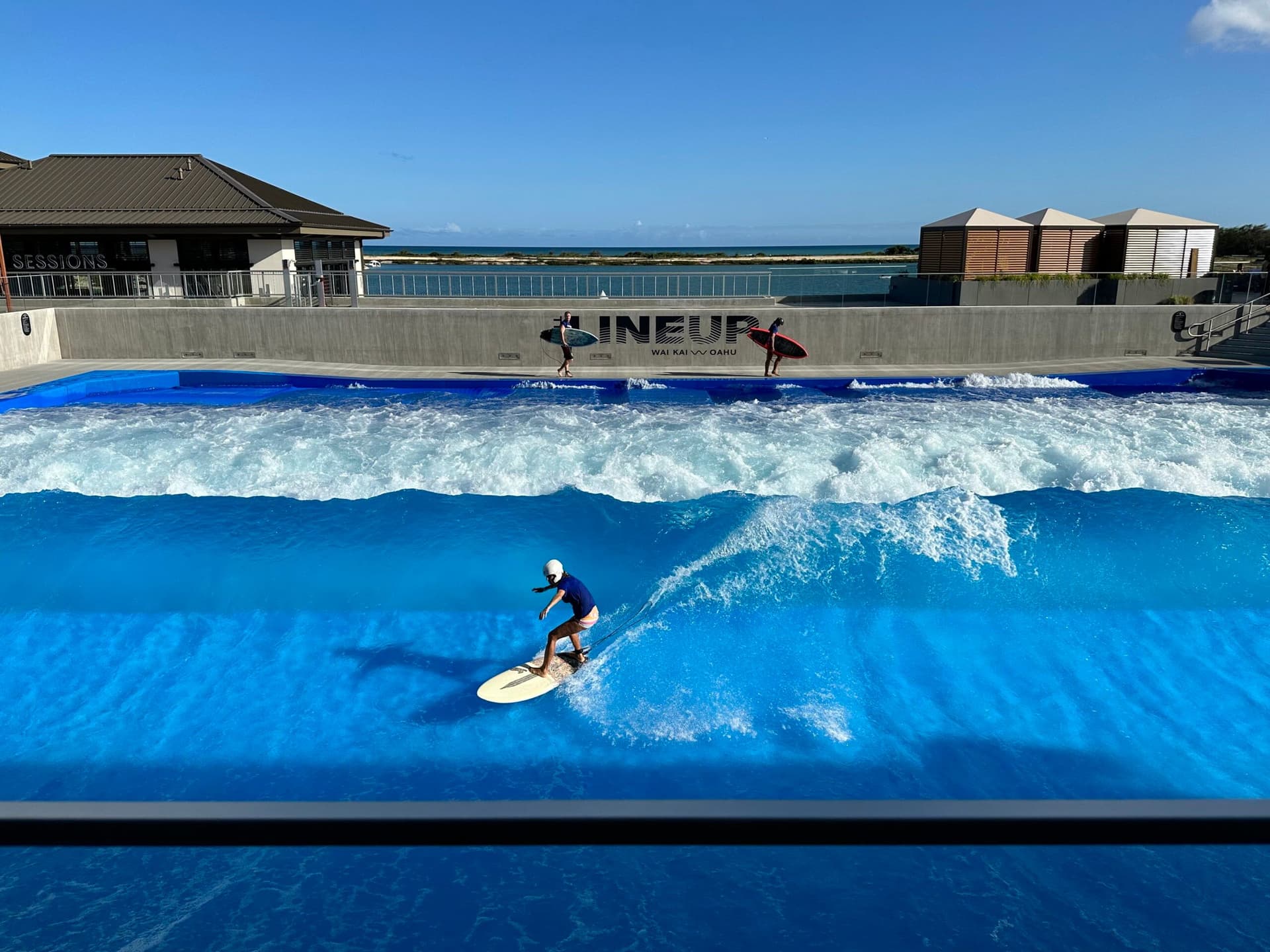 Boy surfing in pool at LineUp at Wai Kai in Ewa Beach on Oahu Hawaii.