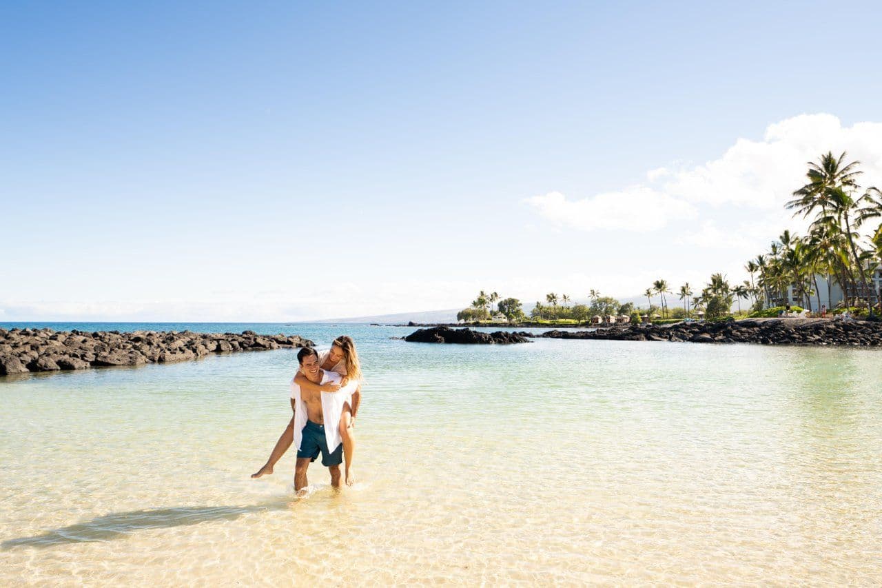 A couple playing in the ocean