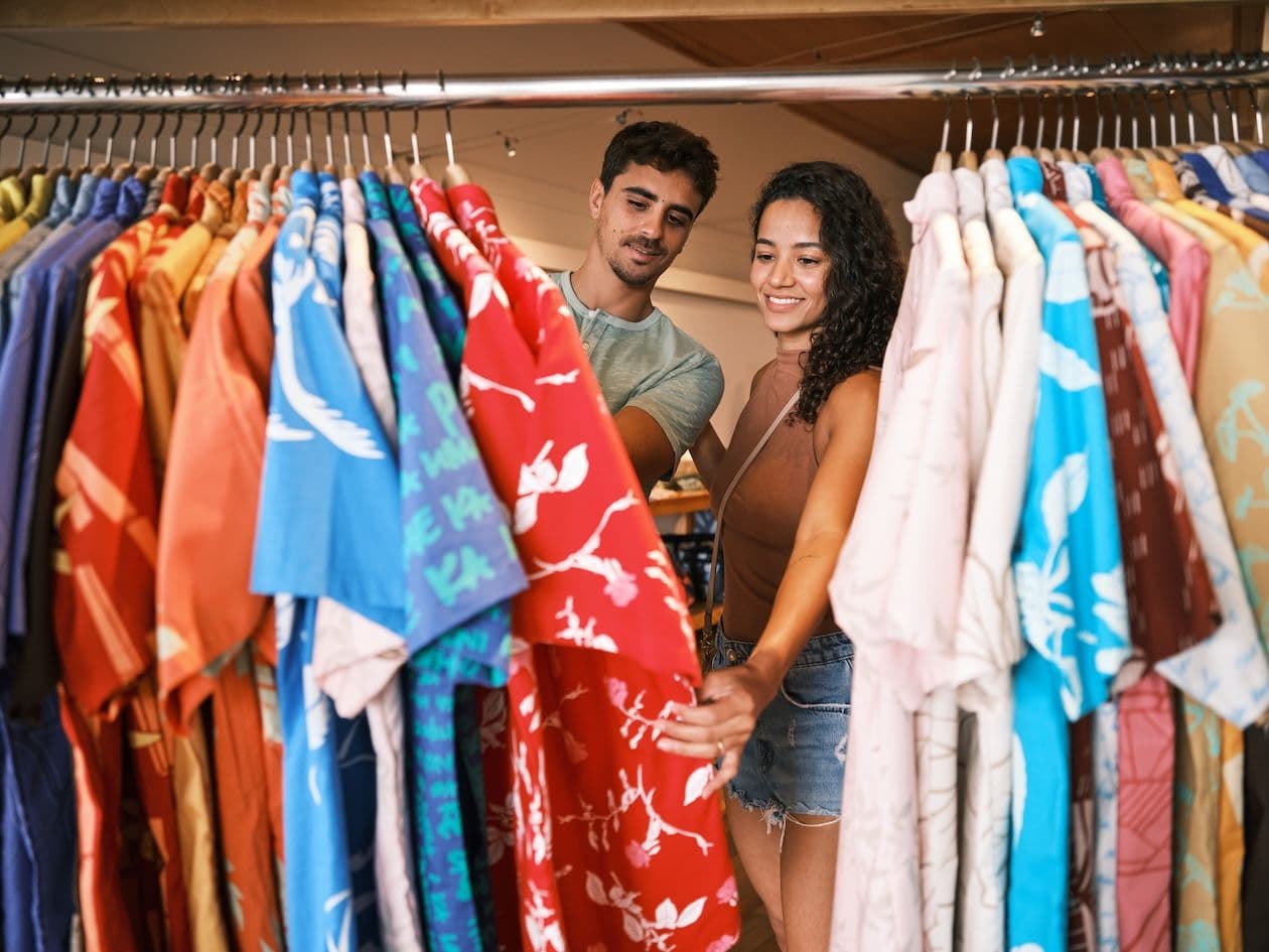 A couple shopping for aloha shirts.