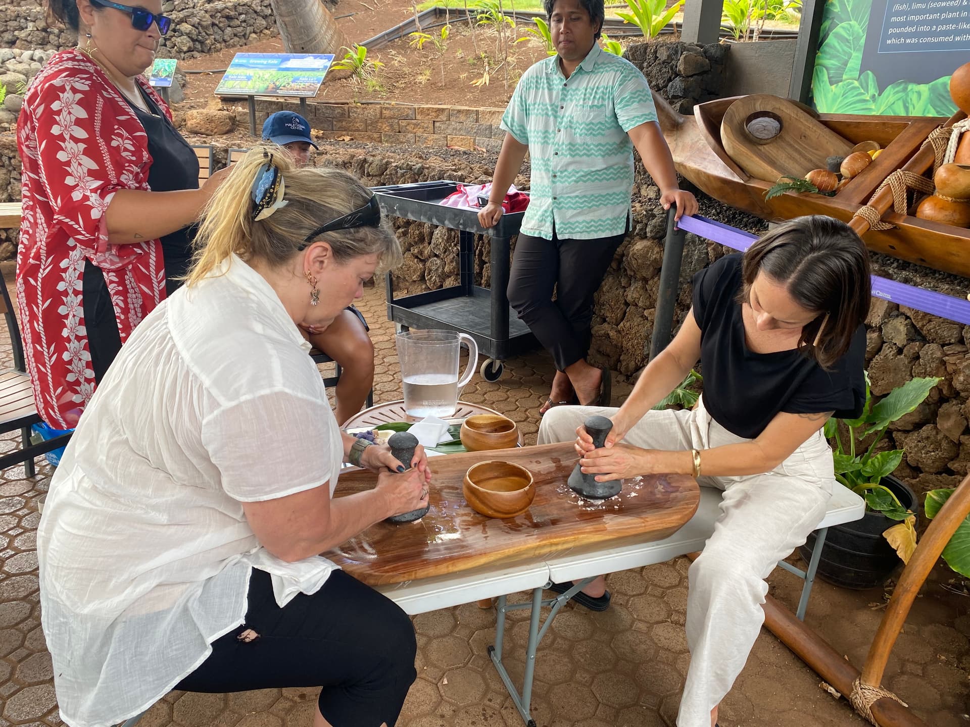 pounding poi on a wooden board