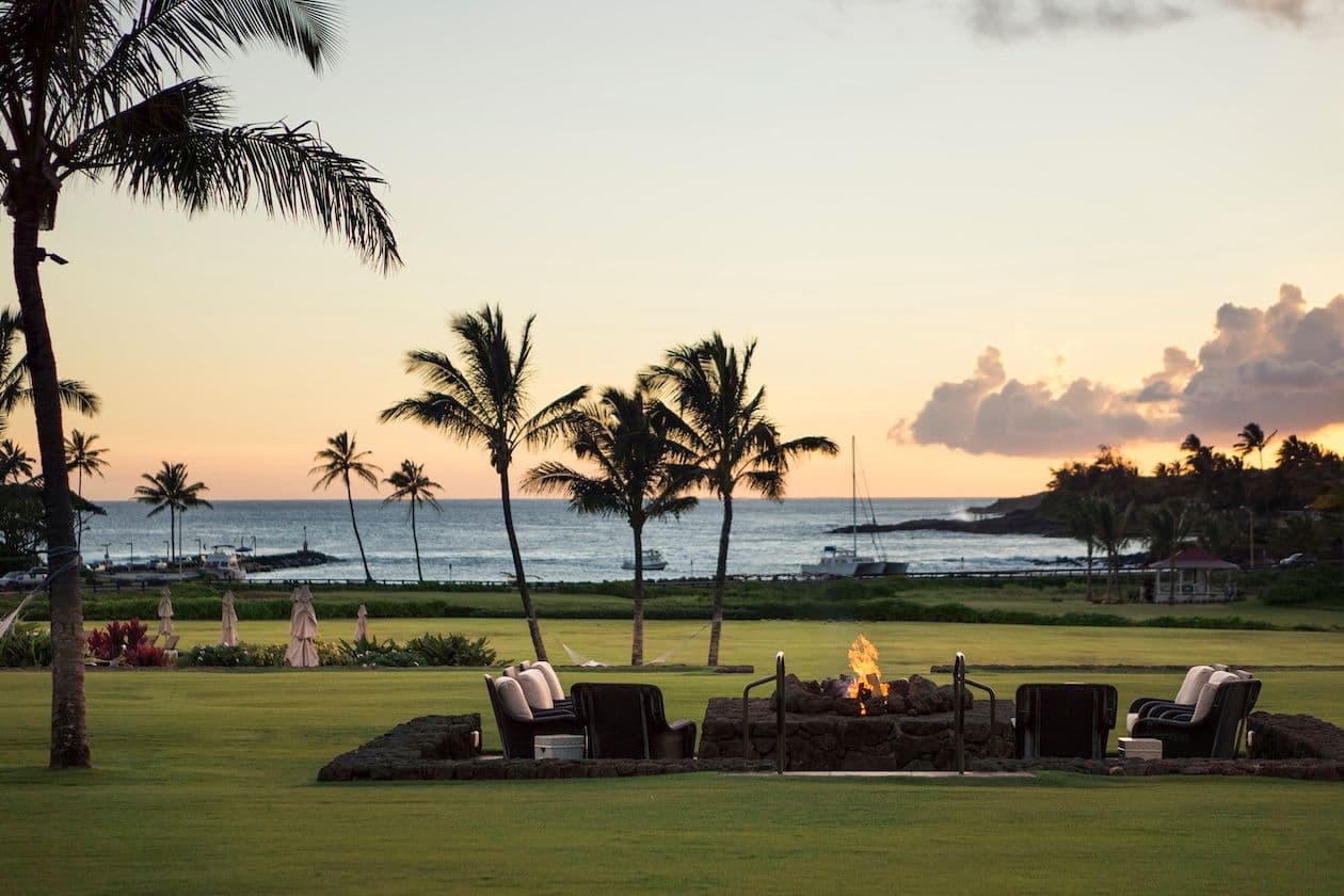 Sunset at The Lodge at Kukui'ula with Spouting Horn in the distance. Photo by David Livingston.