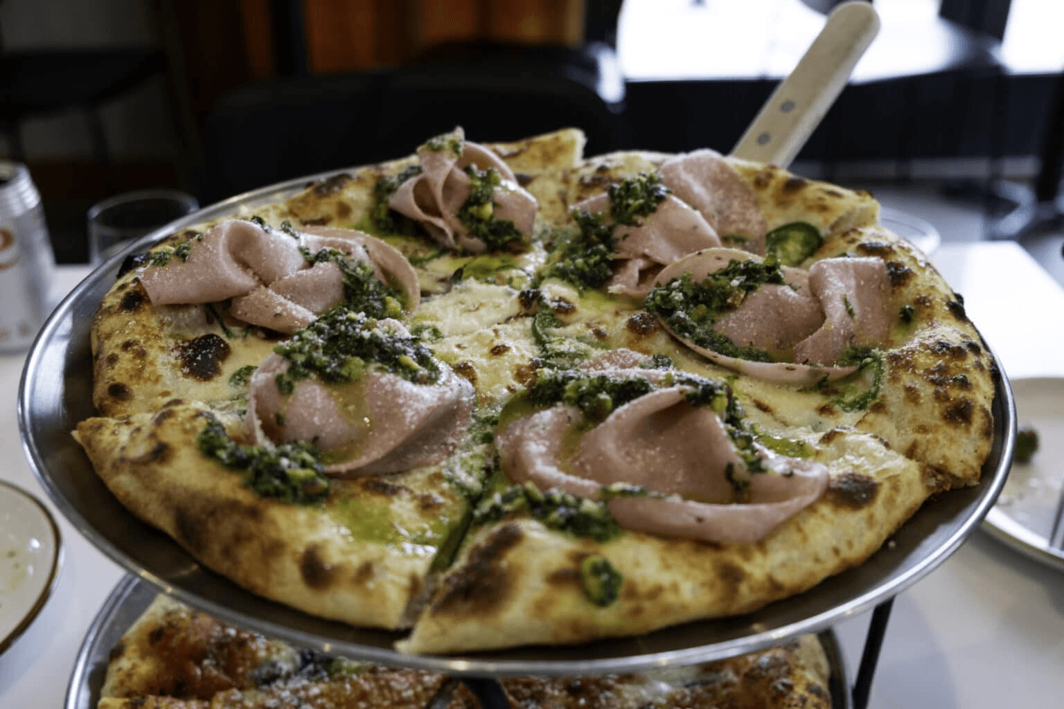 Mortadella “white pie” with mozzarella, jalapeno and pistachio pesto at Marlow. Photo by Sarah Burchard.