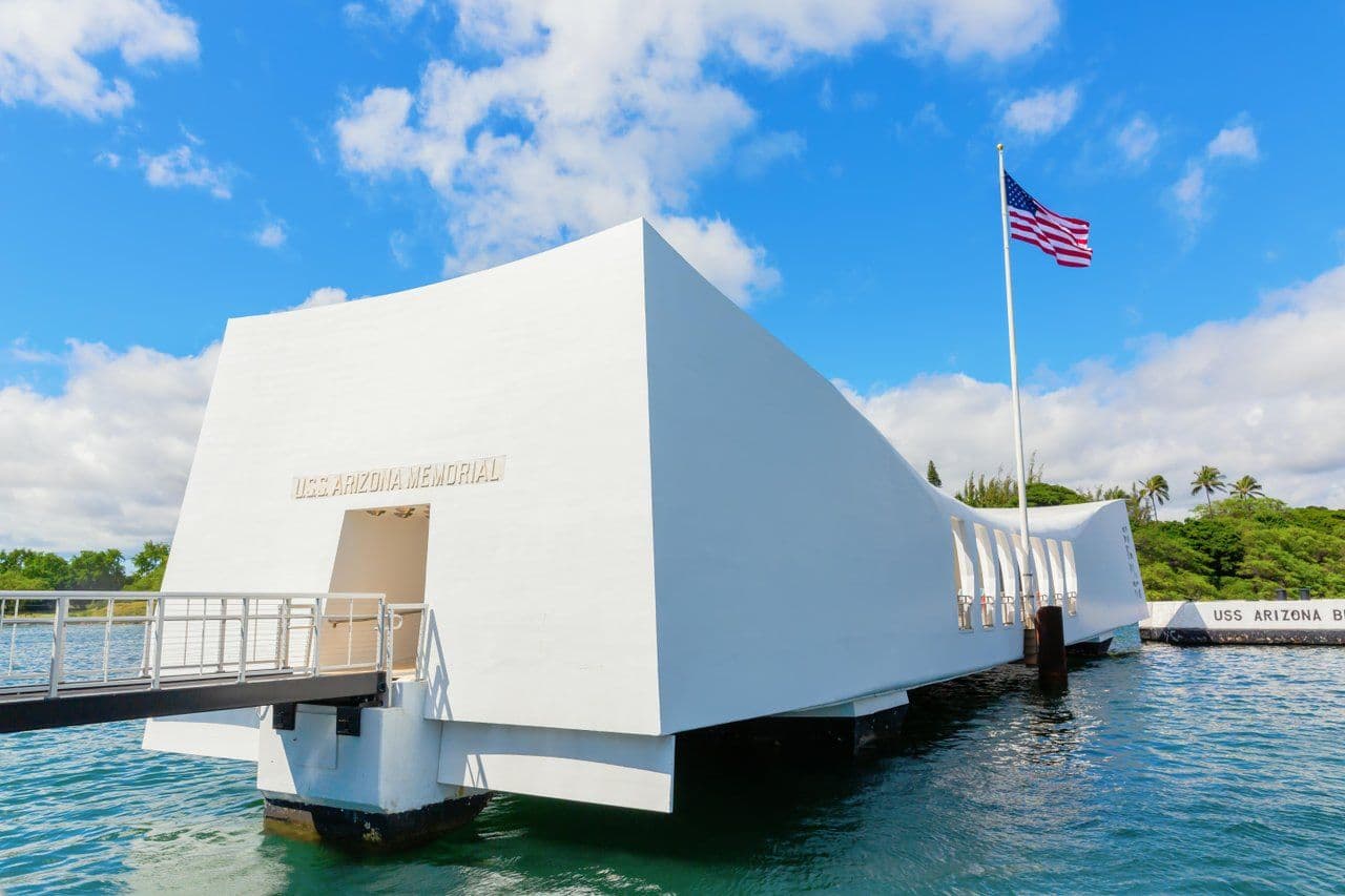 USS Arizona Memorial in the ocean on a sunny day