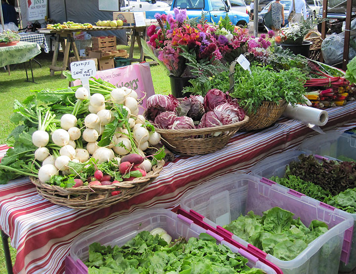 Image of Fresh produce and flowers for sale.