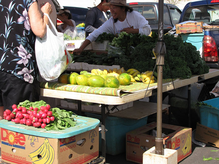Image of beets, papayas, apple bananas, and kale bunches.