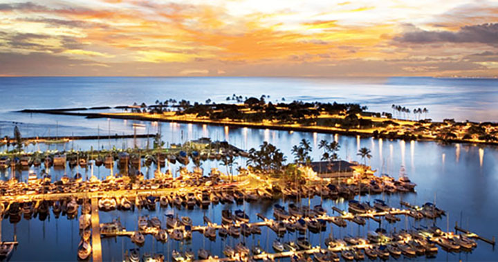 Image of Magic Island and the Ala Wai Yacht Harbor at sunset from the Hawaii Prince Hotel