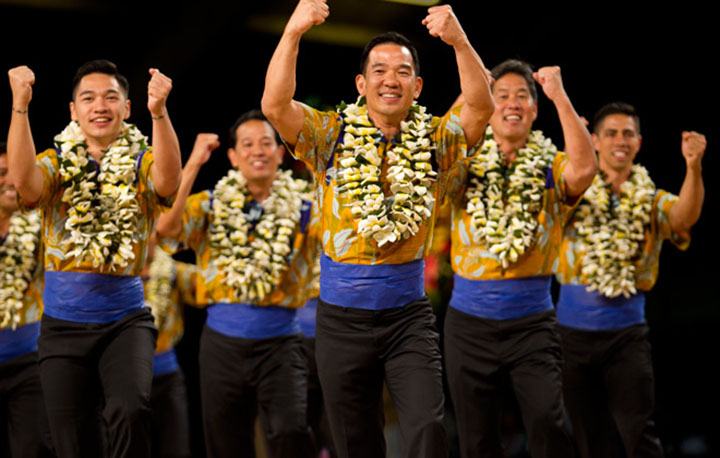 The kane from Na Kamalei (Kumu Hula Robert Uluwehi Cazimero; Honolulu, Oahu) dance during the AUANA portion of the Merrie Monarch Festival competition.  PHOTO BY DENNIS ODA.  APRIL 10, 2015.