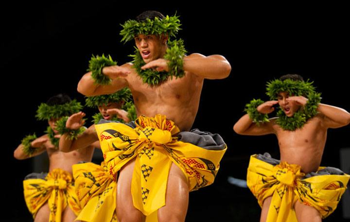 The kane from Ka Leo O Laka I Ka Hikina O Ka La (Kumu Hula Kaleo Trinidad; Honolulu, Oahu) dance during the Kahiko portion of the Merrie Monarch Festival competition. PHOTO BY DENNIS ODA. APRIL 10, 2015.