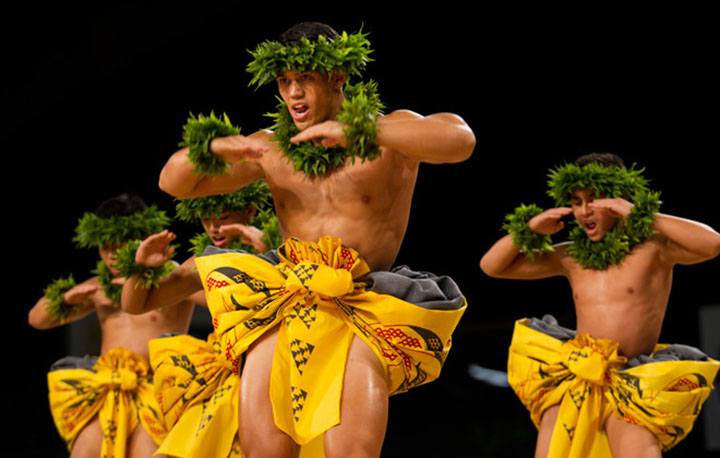 The kane from Ka Leo O Laka I Ka Hikina O Ka La (Kumu Hula Kaleo Trinidad; Honolulu, Oahu) dance during the Kahiko portion of the Merrie Monarch Festival competition.  PHOTO BY DENNIS ODA.  APRIL 10, 2015.