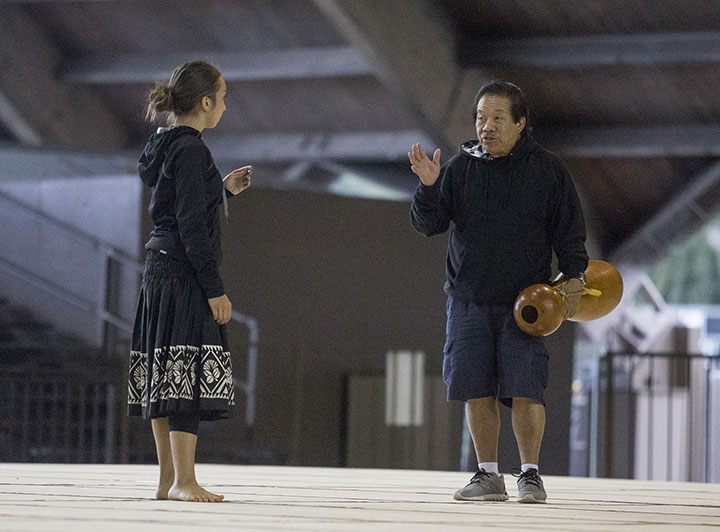 Kumu Hula Johnny Lum Ho talks with Miss Aloha Hula candidate, Kayshlyn Keauli'imailani Victoria De Sa during practice Wednesday night at Edith Kanakaole Multi-Purpose Stadium. Photo: HOLLYN JOHNSON/Tribune-Herald.